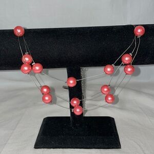 Three string wire necklace with fixed beads